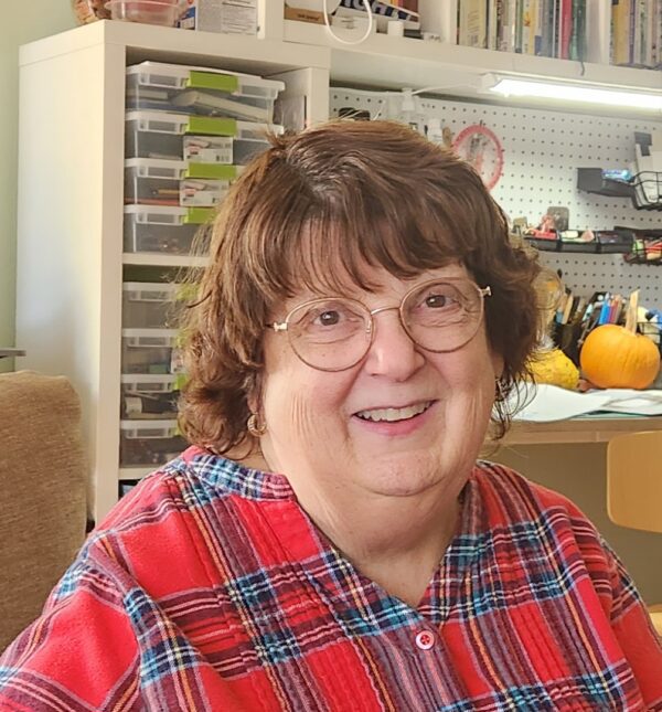 The owner of Sew What Embroidering in her studio