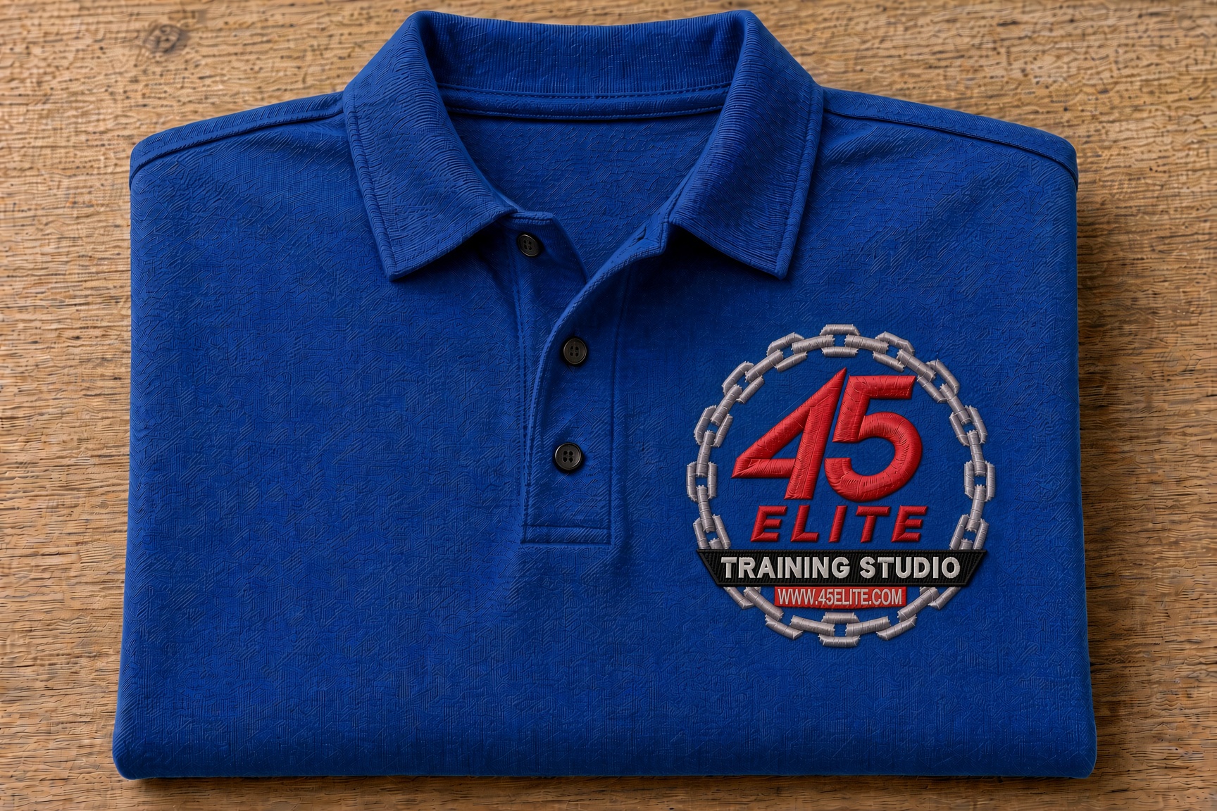 Royal blue polo with the 45 Elite Training Studio logo, ELITE in red